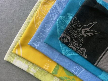colorful yellow, blue and black folded tea towels