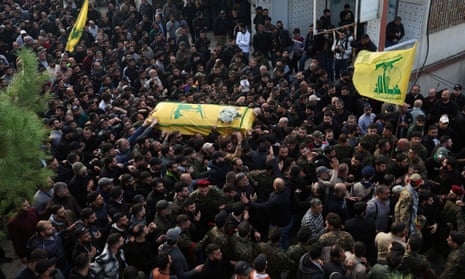 Mourners carry a coffin at Tawil’s funeral in Khirbet Silem, Lebanon