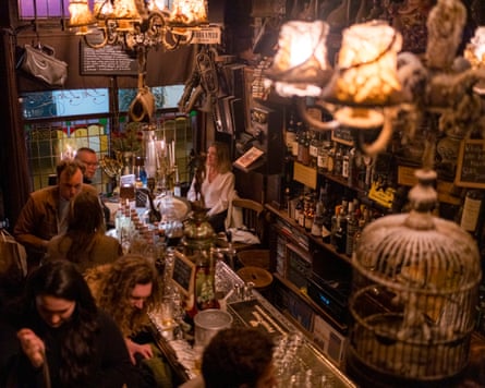 Cluttered interior of brown bar in Amsterdam
