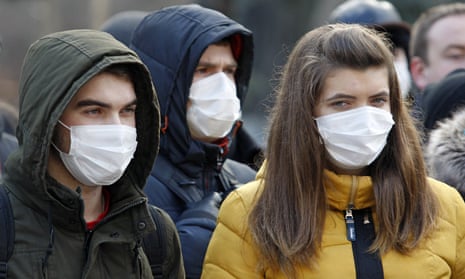 Young people wear face masks in Kiev