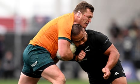 Angus Bell of Australia charges into Nepo Laulala of New Zealand during the Bledisloe Cup match between the Wallabies and All Blacks in Dunedin.