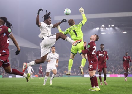 Calvin Bassey Mads Hermansen jump for the ball.