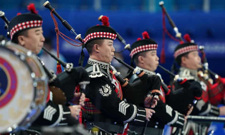 The Beijing military pipe band play before the mixed curling on the first day of the 2022 Games