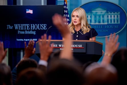 a woman speaks from behind a lectern