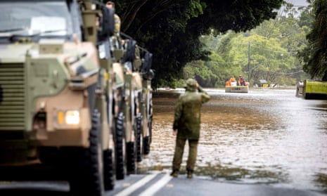 Australian soldiers conduct evacuation tasks during flooding in Lismore, northern NSW, on 30 March 2022. 
