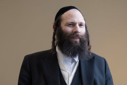 A man in a traditional Orthodox Jewish outfit