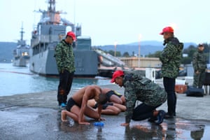 A trainer shouts at a trainee who cannot keep up with the exercises