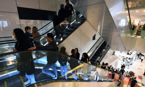 People on an escalator inside the David Jones store in Melbourne