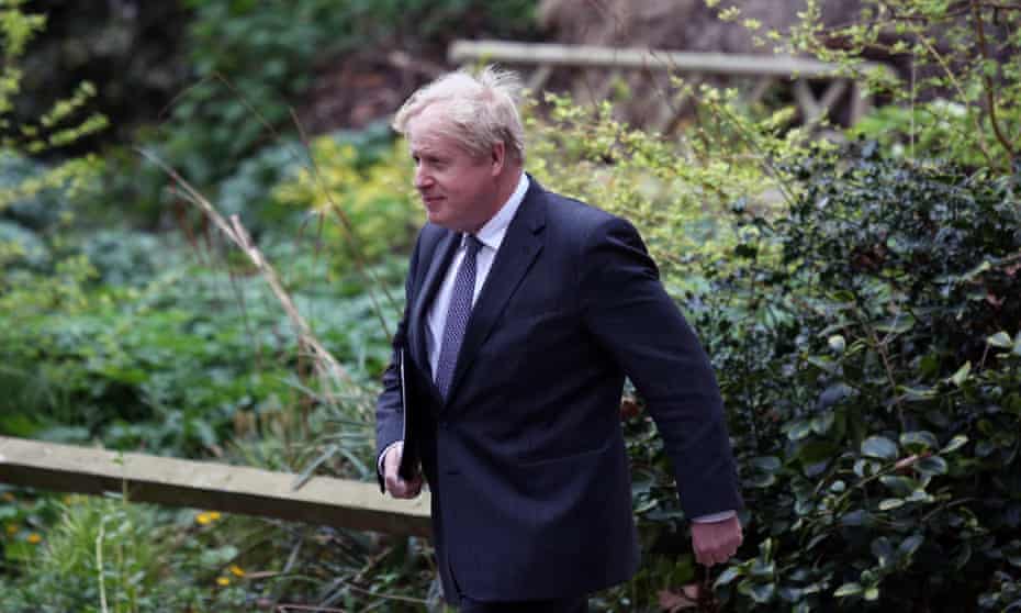 Boris Johnson arrives at 10 Downing Street after a press conference