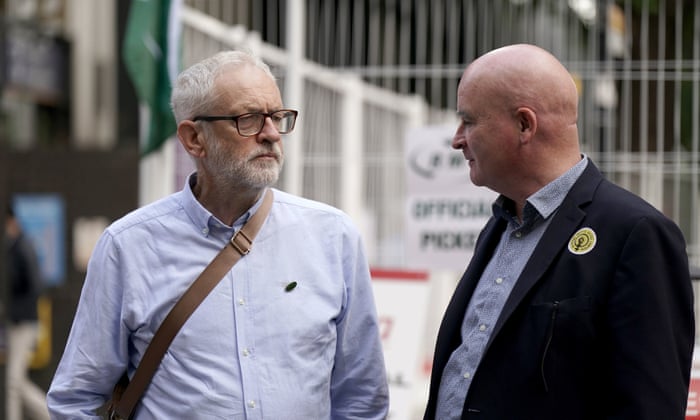 Rail, Maritime and Transport union (RMT) General Secretary Mick Lynch (right) and Jeremy Corbyn outside London Euston train station.