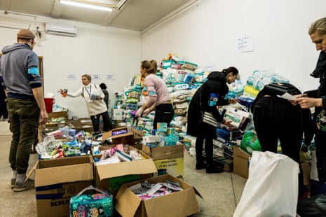 Volunteers gather basic necessities for newborns to give to refugees at the Humanitarian Aid Headquarters in Lviv.