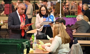 Labour and Conservative party members observe  as ballot are counted