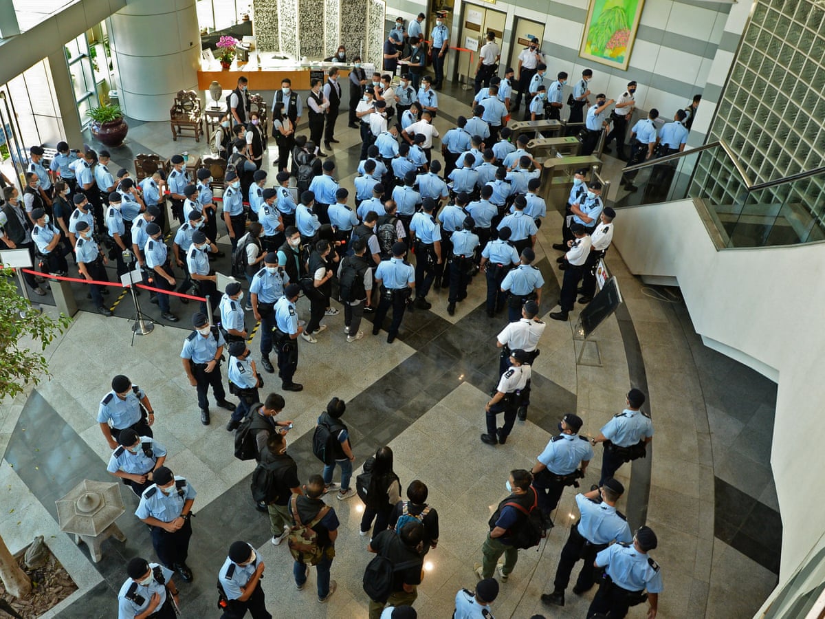 Hong Kong police arrest editor-in-chief of Apple Daily newspaper in raids | Hong Kong | The Guardian