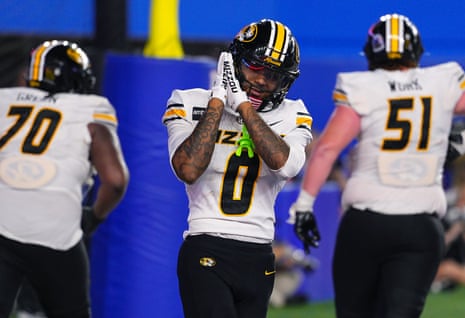 Naeshaun Montgomery celebrates after scoring a touchdown during MissouriâÂÂs 38-21 win over Kansas in Lawrence on Friday night.