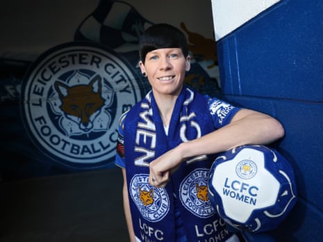 Ashleigh Neville poses in a Leicester City shirt and scarf after signing for the club