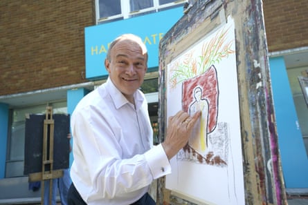Davey smiles while drawing