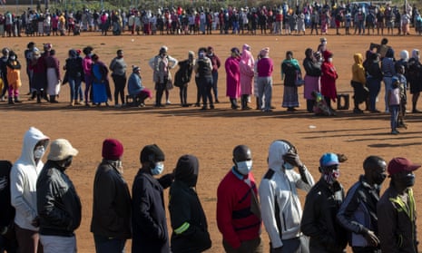 People queuing to receive food parcels in Pretoria, South Africa, in May