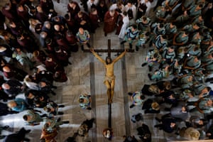 Aerial view of people around a statue of the crucifixion