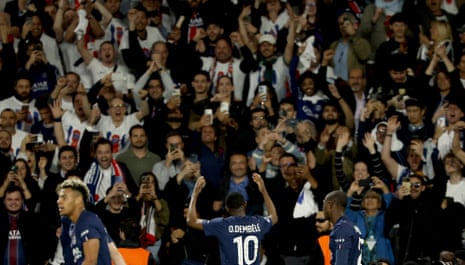 Ousmane Dembele of PSG celebrates with fans after his team's fifth goal.