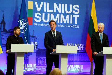 Volodymyr Zelenskyy (L), Mark Rutte (C) and Gitanas Nauseda (R) address a media conference during the Vilnius summit.