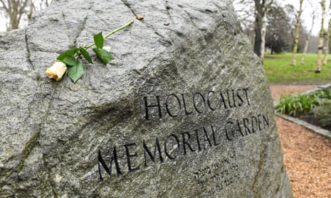 A single rose is placed on the stone in the Holocaust Memorial Garden in Hyde Park, London