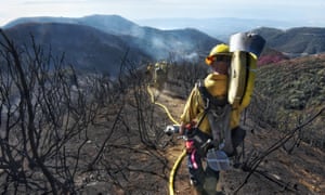 Firefighters in Santa Barbara County work their way through hillsides left charred by California’s largest-ever wildfire.