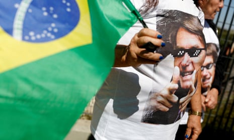 A supporter of Jair Bolsonaro outside the hospital.