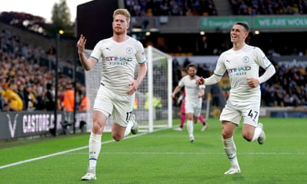 Manchester City’s Kevin De Bruyne (left) celebrates scoring a hat-trick against Wolverhampton in May 2022