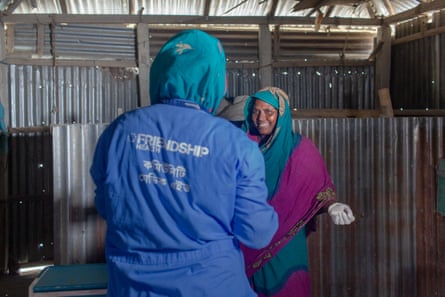 Two workers for the charity Friendship at a testing centre in northern Bangladesh.