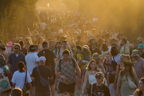 Revellers traverse the old railway track.