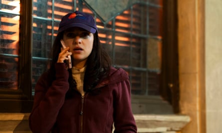 A worried looking woman takes a phone call