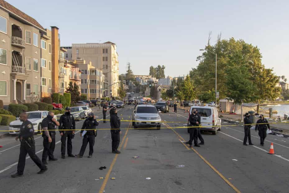 Police officers on the scene at Lake Merritt in Oakland, following a shooting on July 19.