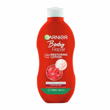 A red bottle of Garnier Body Repair 24H Restoring Lotion