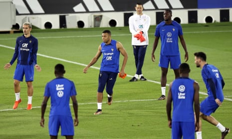 Kylian Mbappé (centre) trains with his France teammates at Al Sadd Stadium in Doha.