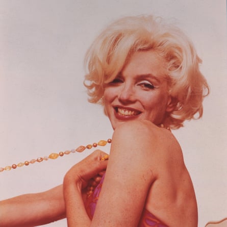 A 1962 pink tinted photograph by Bert Stern of Marilyn Monroe.