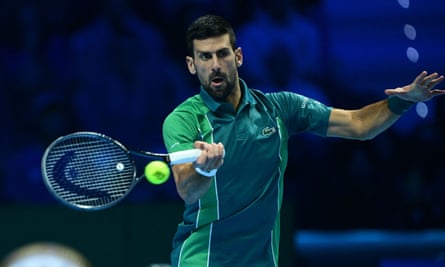 Novak Djokovic hits a forehand return against Jannik Sinner