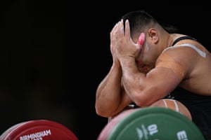 Koale Junior Tasi Taala of New Zealand holds his head in his hands after failing with a lift in the 109kg snatch weightlifting.