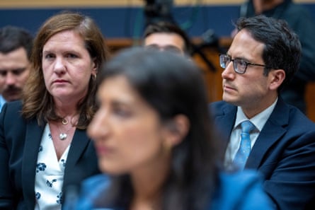 Federal Trade Commission commissioners Rebecca Kelly Slaughter, left, and Alvaro Bedoya, right, listen as chair of the FTC Lina Khan testifies before the House judiciary committee in a hearing on oversight of the FTC on Capitol Hill, on 13 July 2023.