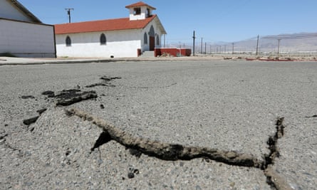 Cracks in the street next to church after a powerful magnitude 7.1 earthquake broke, triggered by a 6.4 the previous day, near the epicenter in Trona, California, 6 July 2019.