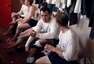 Greaves (centre) talks to teammate Terry Dyson in the Old Trafford dressing room in September 1964