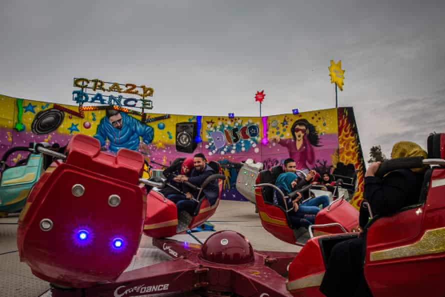 Young couples at a theme park on the banks of the Tigris in Mosul, Iraq, 2018