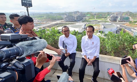 Indonesia President Joko Widodo (R) speaking to the media as he visits the new Presidential Palace in the future capital city of Nusantara