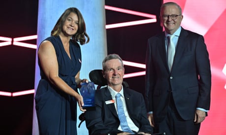2025 Australian of the Year Neale Daniher, with his wife, Jan, and the prime minister, Anthony Albanese, at awards ceremony in Canberra.