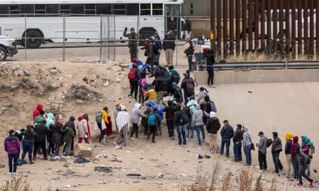 Immigrants seeking asylum turn themselves in to US border patrol agents after wading across the Rio Grande to El Paso, Texas, in December.