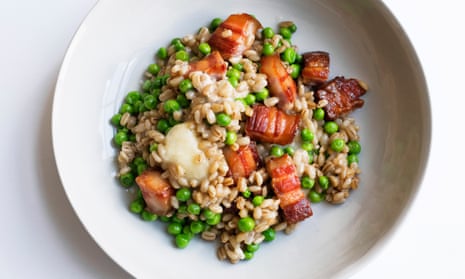 Pearl barley, bacon and taleggio in a white, round bowled dish