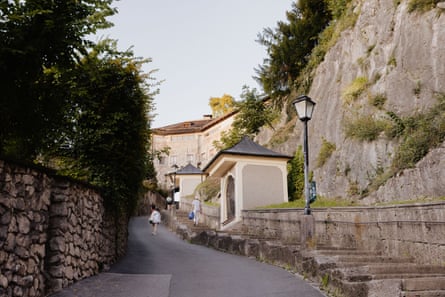 A steep, narrow road with steps on one side