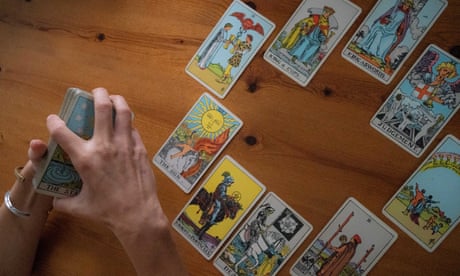 Jessica Dore arranges tarot cards at her home in Pennsylvania. ‘Tarot is a set of metaphors that can help somebody understand something.’