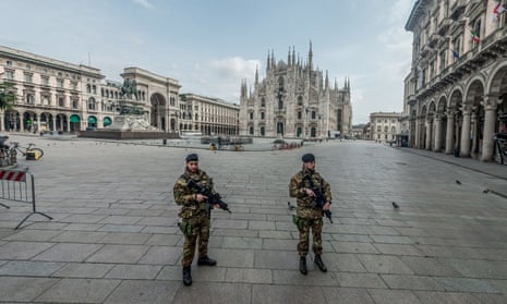 Soldiers stand guard at Piazza del Duomo in Milan, Italy.