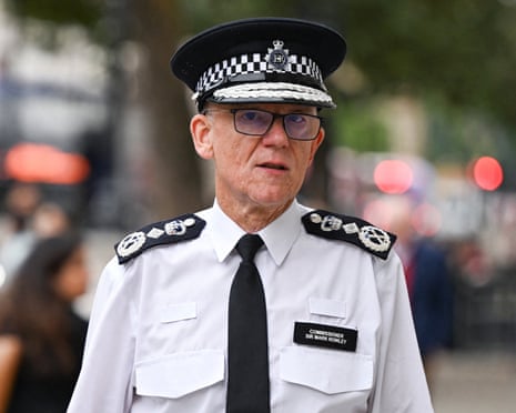 Metropolitan police commissioner Mark Rowley walks along a street in uniform