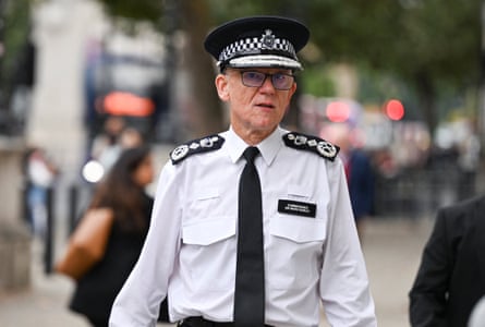 Sir Mark Rowley in his police uniform walking down the street